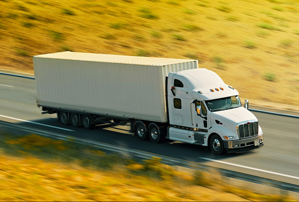 truck on freeway pulling load